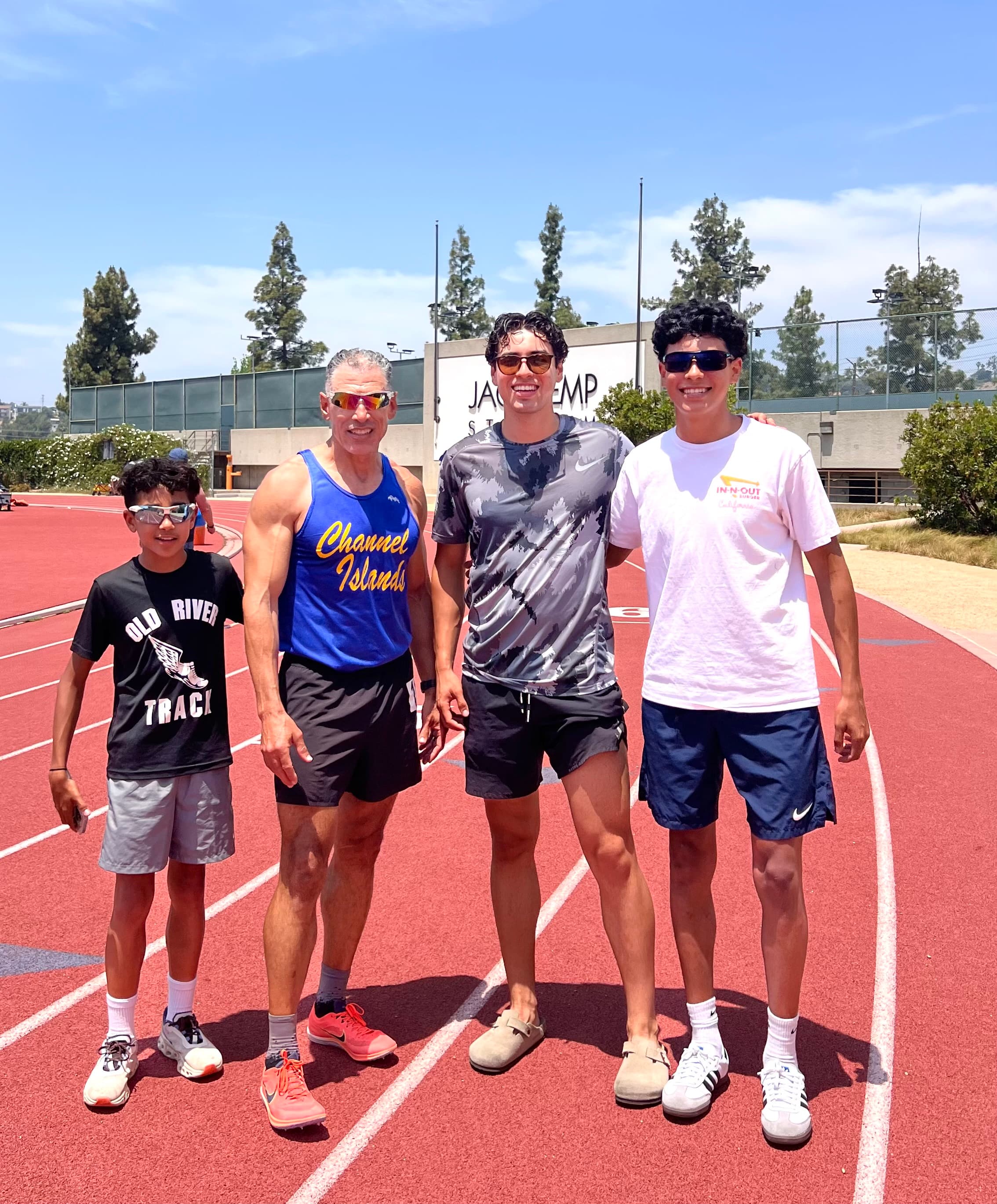 Cristian with his dad and brothers at the track, sharing their love of running and fitness