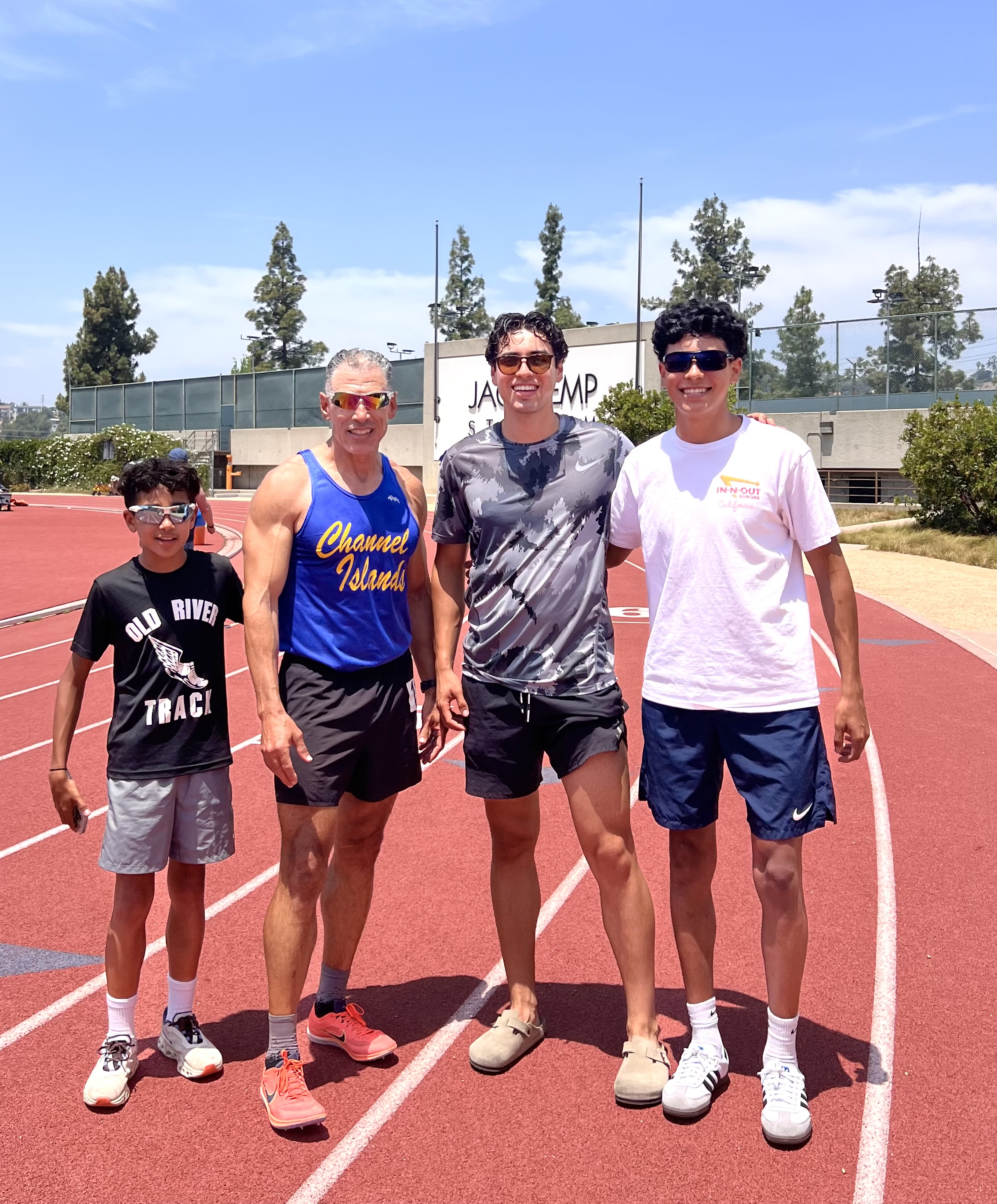 Cristian with his dad and brothers at the track, sharing their love of running and fitness